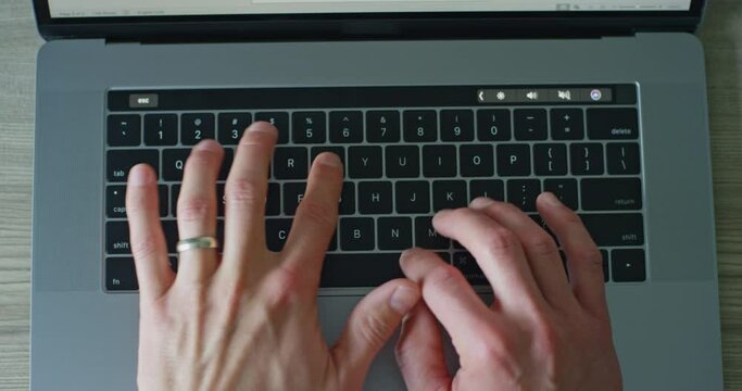 Straight Down Male's Hands Typing On Keyboard
