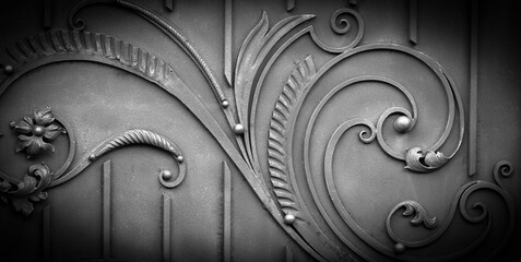 Wrought-iron gates, ornamental forging, forged elements close-up.