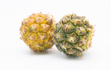whole pineapple with leaves isolated on white background