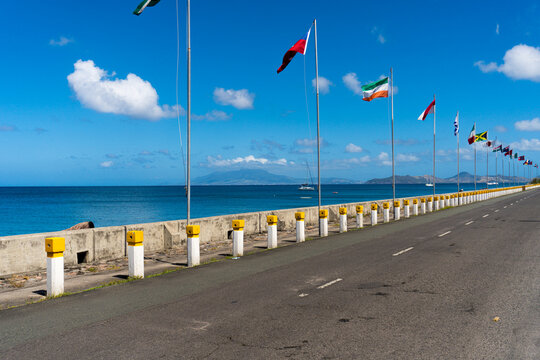 The new seawall at Charlestown, Nevis. Saint Kitts in the background, across the channel known as "The Narrows". Charlestown is the main administrative and commercial center for the island of Nevis.