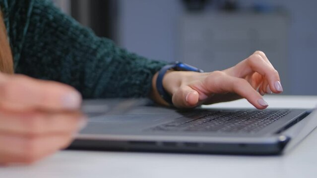 Person making a payment online with a credit card. Woman buying in a internet store