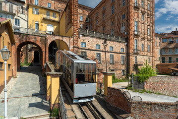 Mondovì, Italy - April 29, 2022: Funicular train arriving at top station of rione Piazza with...