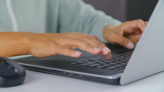 Black Woman Typing Text On A Notebook Keyboard In Close-up