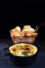 meatball pan with sauce and cheese, with toast bread and spices tasty food