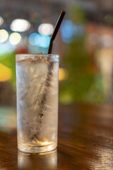 Fresh iced pure water on wooden table at cafe environment with copy space in summer.