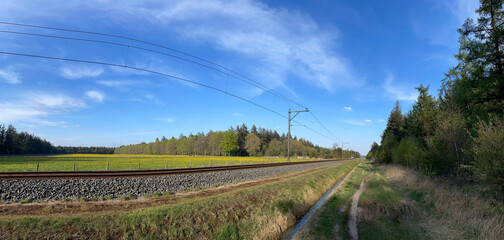 Fototapeta na wymiar Panorama from the MTB track next to train track