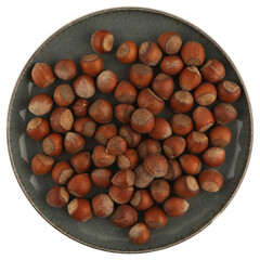 a bowl with mixed nuts on a white table on top. Healthy food and snacks. Walnuts, pistachios, almonds, hazelnuts and cashews.