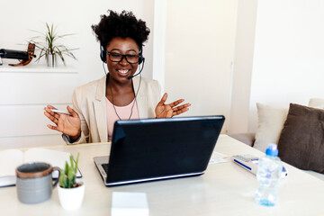 Close-up of a businesswoman using headset. Call center service. Beautiful customer support or sales female agent. Caller or receptionist phone operator. Copy space. Helping, answering, consulting.