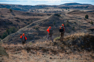 Hunters scouting in the midwest North Dakota Badlands looking for deer