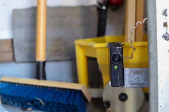 Close Up Of A Broken Garage Door Opener Photo Eye Sensor