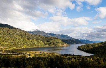 fjord entering the green mountains in chilean patagonia