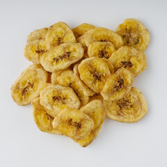 delicious dried banana on a white acrylic background