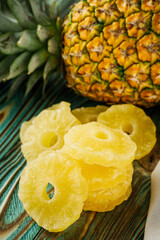 delicious dried pineapple on a wooden rustic background