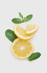 Lemon slices with mint on a white isolated background