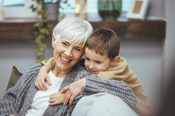 Grandma and grandson spend beautiful time together, they are happy and enjoy themselves. The child...