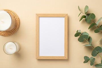 Top view photo of wooden photo frame candles on rattan placemat and eucalyptus branches on isolated...