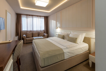 Interior of a luxury hotel double bed bedroom