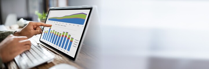 Businessman Analyzing Graph On Laptop