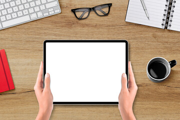 Fototapeta na wymiar Hands holding digital tablet with blank screen on office desk