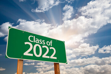 Class of 2022 Green Road Sign with Dramatic Clouds and Sky