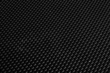 Black metal geometric grid texture steel background. Perforated sheet metal.