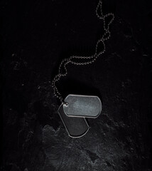 American military dog tags. Rough and worn with blank space for text. Memorial Day or Veterans Day concept.