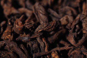 Chocolate black leaf shu pu-erh tea with cocoa beans close-up macro photography