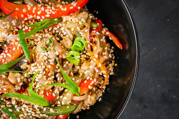 delicious chinese fried noodles on a black background