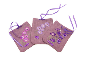 Purple linen pouch with embroidered flowers storage pouch for small items, for dried herbs, aromatic pouch, interior detail. Isolated on white background
