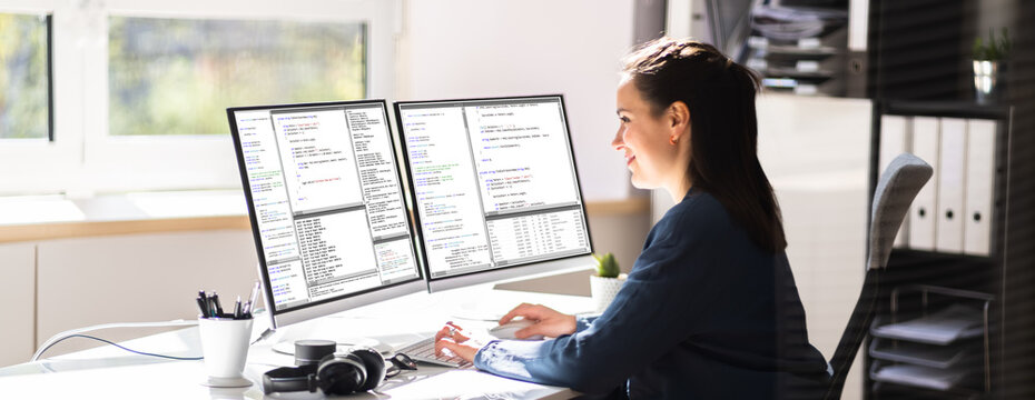 Coder Engineer Using Multiple Monitors