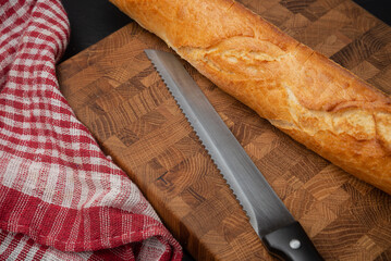 File knife for bread near the baguette