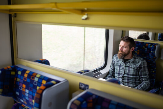 Handsome Man Traveling On A Train