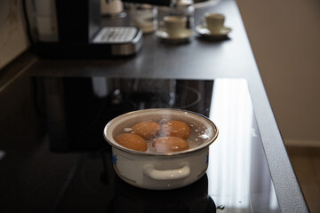 four eggs boiling for breakfast
