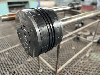 The gas compression piston in the compressor is a close-up. Large piston with piston rings