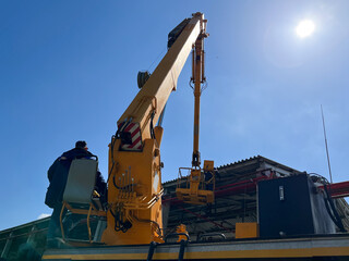 A tower car is a car equipped with a device for lifting and moving workers with tools and materials © yarm_sasha
