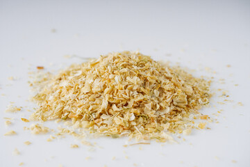 dried onions on a white acrylic background