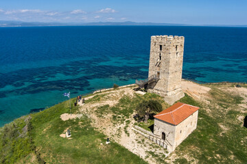 Fototapeta na wymiar Aerial view of byzantine tower and beach of village Nea Fokea in Chalkidiki Greece