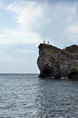 Fototapeta na wymiar Peoples on the edge of the Cape Fiolent, Sevastopol, Crimea