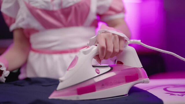 Headless lolita maid in pink costume ironing masters elegant shirt 4K