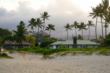 Stormy weather over an ocean front house on Lanikai Beach in Kailua, on the eastern side of Oahu in Hawaii, United States