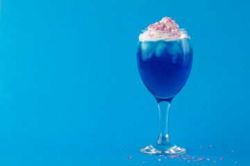 Blue Cocktail with Ice and Whipped Cream