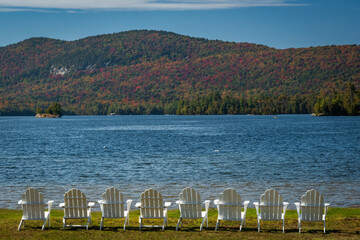 Adirondacks Lake in Fall with Adirondack Chairs Lined Up