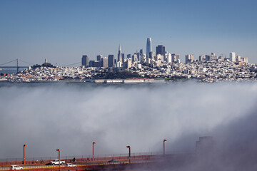 San Francisco with the Golden Gate Bridge in the Foreground Being Swallowed by Fog