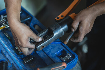 Technician working on electrical wires in control cabinet