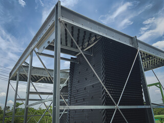 Install the air filler sheet in the cooling tower system.