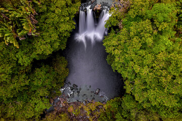 Fototapeta na wymiar Aerial Long Exposure view of Leon waterfall (Cascade Leon) which is hidden in a forest located in the south of Mauritius island