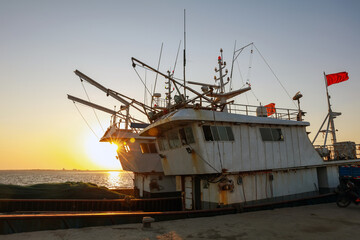 Wooden fishing boats on the coast in the evening