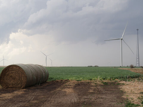 Wind turbines near Durham, Kansas, just off Kansas Highway 15. Bales of hay are in the foreground. 