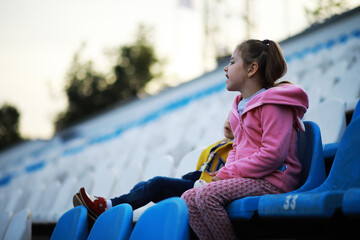 Plastic chairs in the stands of a sports stadium. Cheer on the stands of the stadium.