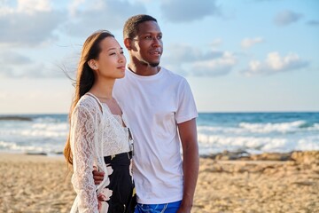 Young couple in love on the beach together.